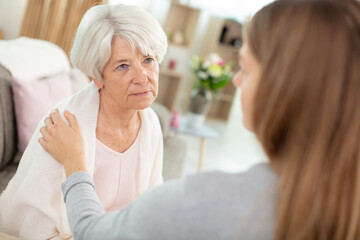 Fototapeta premium senior mother is talking to daughter