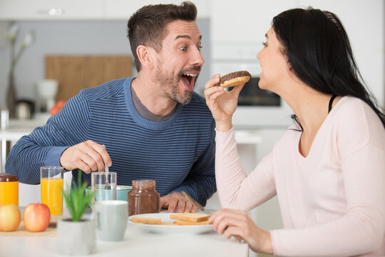 Adult Man And Woman Sharing Breakfast