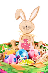 Easter bunny with colourful eggs with polka dots in a basket