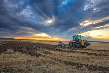 Tractor plowing the fields
