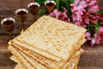 Four cups full of wine with matzah. Jewish holidays Passover.