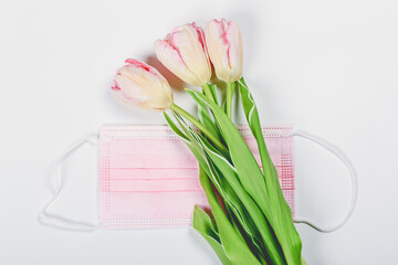 pink tulips and pink medical mask