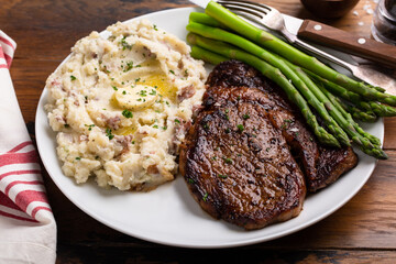 Traditional steak and mashed potatoes with blanched asparagus - Powered by Adobe