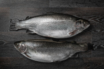 Fresh raw salmon red fish on a wooden table. Creative layout made of fish, seafood, top view, flat lay