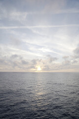 Sunset photo at the sea with clouds.