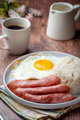 Hamsilog (vertical)- famous Filipino meal that consists of fried rice, egg and ham slices.