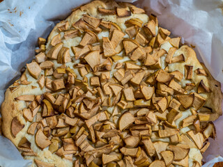 homemade charlotte cake in baking parchment. Prefabricated. top view