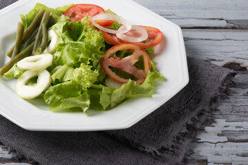 Plate of healthy food with lettuce salad