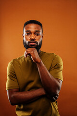young pretty african american man posing cheerful on brown background, lifestyle people concept