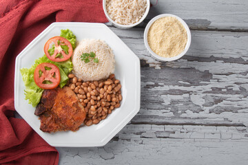 Traditional dish of Brazilian food beans with rice top view
