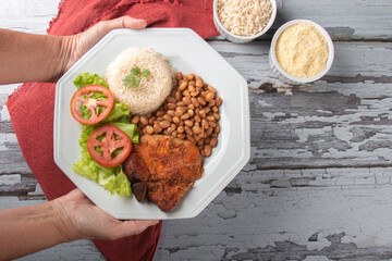 Traditional dish of Brazilian food beans with rice top view