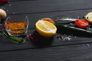 Spices and herbs over wooden background, healthy or cooking concept.