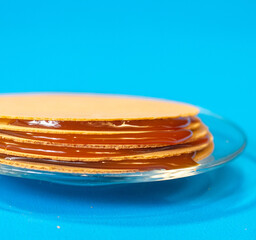 wafers with goat's milk candy on blue background. obleas, a typical sweet of mexico and latin america