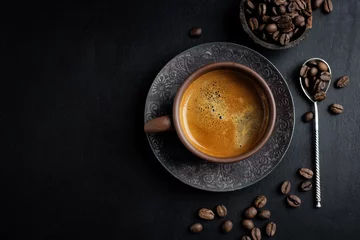 Keuken foto achterwand Koffie Fresh made coffee served in cup on dark