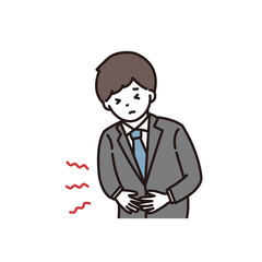 腹痛で苦しむスーツ姿の若い男性