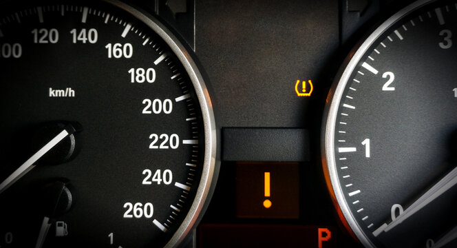 Closeup Of Lose Tyre Pressure Alert In Dashboard Car On Background.	