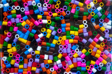 colourful plastic bead patterns close-up