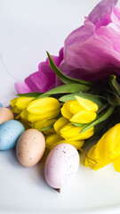 Spring composition of yellow tulips and Easter eggs. 