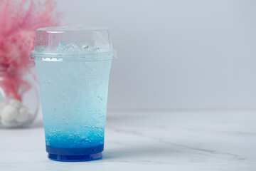 Blue Hawaii with sparkling water on white background
