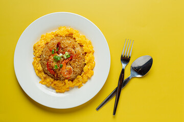 Kimchi fried rice on yellow background