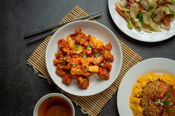Korean sauce fried chickens on dark background
