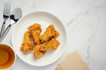 Fried chicken on marble background