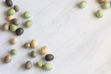 Easter background with eggs, top view, soft colors, space for text, simplicity.