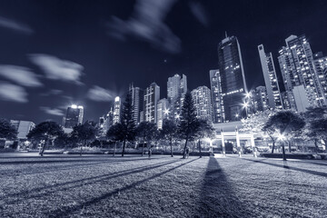 High rise office building and public park in downtown of Hong Kong city at night