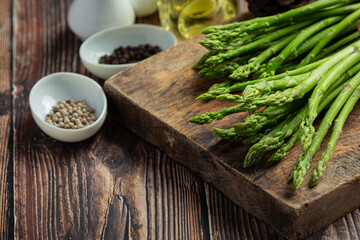 fresh green asparagus on wooden background