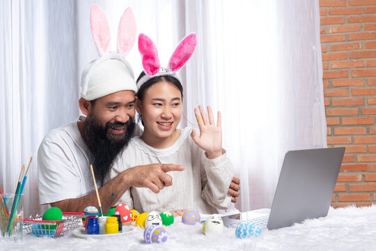 couple painting Easter eggs on Easter