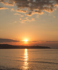 Naklejka na ściany i meble Welcoming the sunrise on the Black Sea coast in the morning