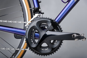 Detail of bicycle components. Closeup of crankset, front derailleur and chains - obrazy, fototapety, plakaty