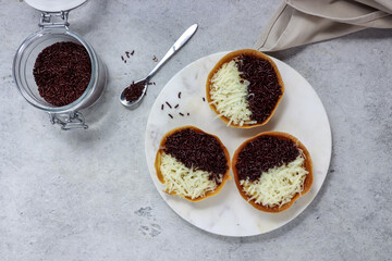 Martabak Terang Bulan mini, martabak manis mini or mini sweet martabak (mattabak), is Indonesian popular street food, made from flour, egg, yeast, topped with peanuts with chocolate