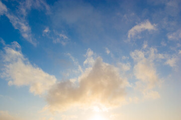 Naklejka na ściany i meble Beautiful sunset clouds against blue sky. Nature sky backgrounds.