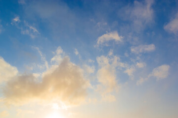 Naklejka na ściany i meble Beautiful sunset clouds against blue sky. Nature sky backgrounds.