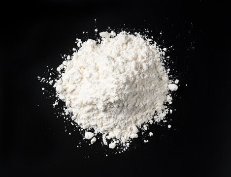 White flour on black background
