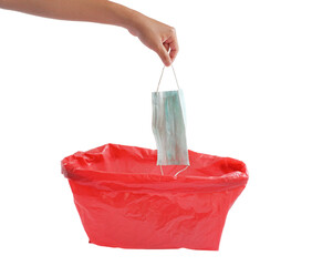 Man throwing a disposable face mask in red bag for biohazards waste isolated on white background. So that the pathogen does not spread