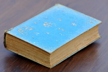 Fototapeta premium Really old book on wooden floor