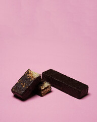 Wafer isolated on pink background. Chocolate biscuit wafers filled with delicious chocolate cream. Dry and crispy wafers ready to eat. Ready to start the day with wafers. Wafer snacks. Wafer mock up.