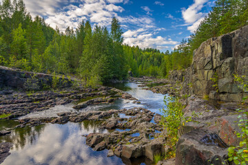 Fototapeta na wymiar A riverbed near Girvas waterfall in Karelia, Russia