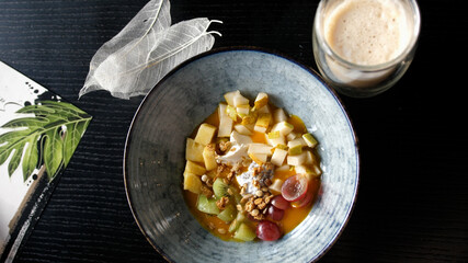 Eating healthy Breakfast smoothie bowl with latte. Acai Smoothie, Granola, Seeds, Fresh Fruits. Clean Eating, Dieting, Detox, Vegetarian, Vegan Food Concept.
