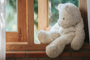 Teddy bear sad in an empty room, national child abuse prevention month