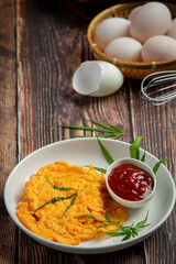 Egg omelet with marijuana leafs on old dark background