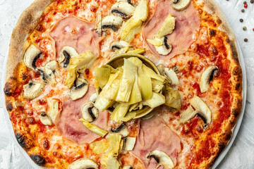 italian capriciosa pizza. Food recipe background. Close up. Pizza menu on a light background, top view