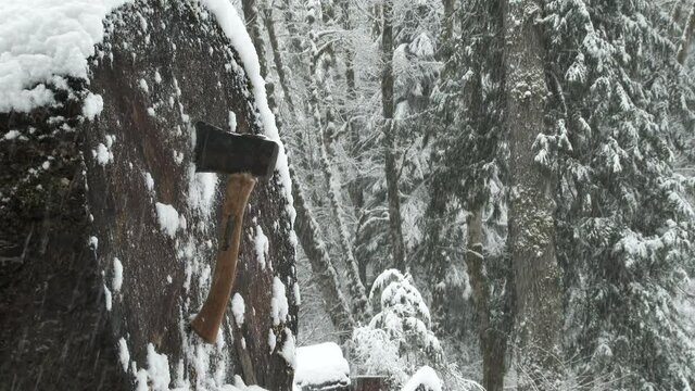 Throwing Axe Hitting Wood Target In Snowy Forest