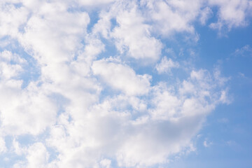 Beautiful blue sky background with tiny clouds. Natural cirrus cloud background.