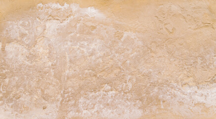 The texture of the stone is beige.Rock, decorative stone. Rough texture of the stone.