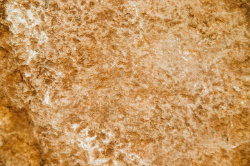 The texture of the stone is beige.Rock, decorative stone. Rough texture of the stone.