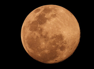 Close up of a bright full moon on the dark night, Big full moon on black background.