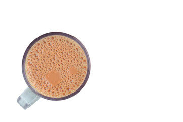 Tea with milk in a mug isolated on a white background. Top view.